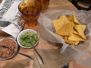 Chips and guac with side of pinto beans at Chiles Mexican Grill in Tokyo