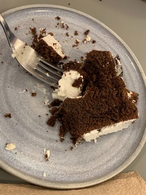 Chocolate brownie with whipped cream. at Bioma in Buenos Aires