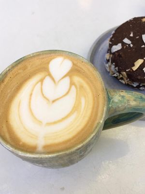 Cappuccino and vegan alfajor. at Bioma in Buenos Aires