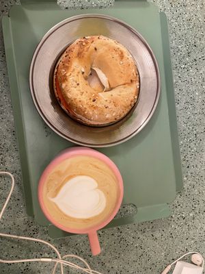 Bagel with vegan ham and cheese with almond milk latte at Bioma in Buenos Aires