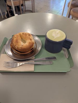 Bagel jamón y queso con matcha latte at Bioma in Buenos Aires