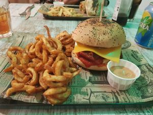 Meatball burger with curly fries at Bioloco in Madrid