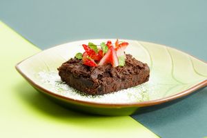 Chocolate brownie based on black beans, with chocolate icing, sweet potato and almond butter. at Rock and Rolls Vegan Sushi in Panama City