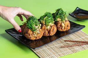 Japanese rice, shiitake mushrooms, dynamite papaya kimchi, avocado, cucumber, marinated tomato, roasted paprika, wakame. Chive topping, crunchy sweet potato.  at Rock and Rolls Vegan Sushi in Panama City