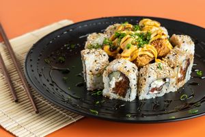 Red Ocean Roll: Japanese rice, marinated tomato, cucumber, coconut cream cheese. Crunchy tofuron topping, Fuji sauce and Sweet Soul. at Rock and Rolls Vegan Sushi in Panama City