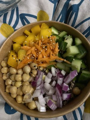 Quinoa salad with chickpeas, cucumber, carrot and mango at Veganissim in Paris