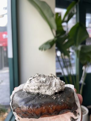 Vegan donut with black sesame and cream  at O.verte Donuts 오베흐트 도넛 in Seoul