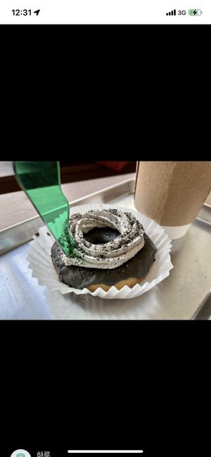 The doughnuts are often decorated extravagantly   at O.verte Donuts 오베흐트 도넛 in Seoul