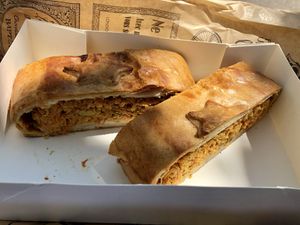 Savory slice with vegetable and seitan(?) filling. Was delicious!!!  at Poppynut in Saint-die-des-vosges