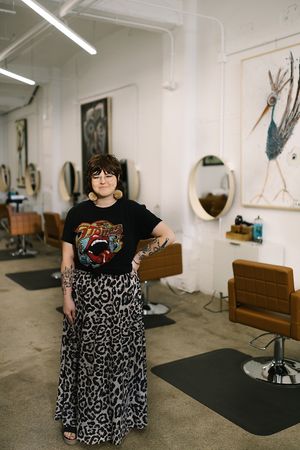 Olivia standing in the salon  at Olive The Hairapist in Fort Wayne