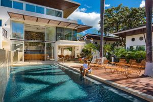 Natural salt water pool with an al fresco restaurant and bar  at Mother Earth Vegan Hotel in Tamarindo