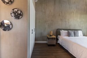 Our King Rooms are perfect for couples, each of our rooms comes with a private terrace with acapulco rocking chairs.  at Mother Earth Vegan Hotel in Tamarindo