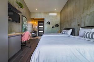 Our Double Rooms are perfect for friends traveling together, each of our rooms comes with a private terrace with acapulco rocking chairs.  at Mother Earth Vegan Hotel in Tamarindo