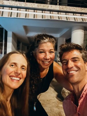 The amazing owner of the restaurant. (In the middle😄 at Mother Earth Vegan Restaurant in Tamarindo