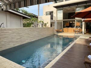 A swimming pool  at Mother Earth Vegan Restaurant in Tamarindo