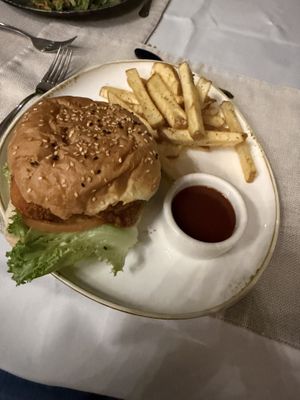 Buffalo white mushroom burger with fries   at Mother Earth Vegan Restaurant in Tamarindo
