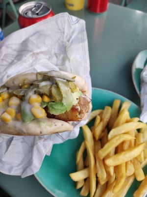 Un bao con tofu, palta, choclo y pepinillo con papas fritas at Taoveg in Santiago