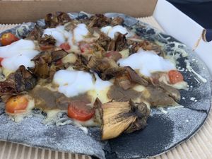 Pizza with artichoke and vegan mozzarella at Alpino in Paleo Faliro