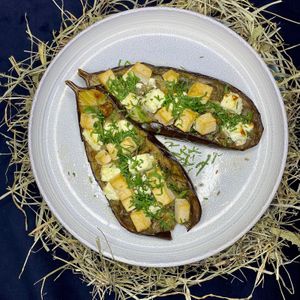 Aubergine farcie au formage de brebis et tofu fumé au foin par nos soin at O-Berny in Lyon