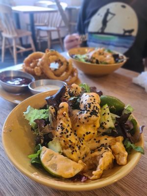 Twisted 'shrimp' in a spicy sauce ...AMAZING  & onion rings in the background at Vibes in Dorchester