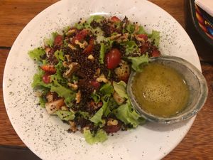 Amazing vegan salad with red quinoa, nuts, strawberries and tomatoes  at Uku Pacha in Quito