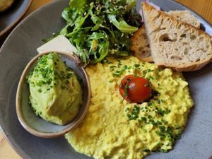Scrambled tofu and extra avocado. The bread was remarkably good. at Mana Food - Moabit in Berlin