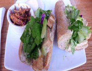 grilled western tofu hero: thickly sliced western tofu, dill soy-mayonnaise, mixed greens served on a toasted french baguette... at Sacred Chow in New York City