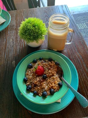 Oatmeal with fruit and crunchy granola, lavender oat milk hot latte   at Koffie House  in Key West