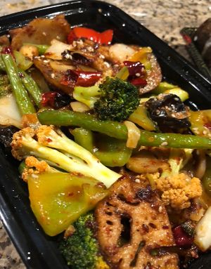 Vegetable in Dry Pot—to go! Just a hint of heat ❤️. at Trendy Vegan in Houston