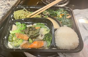 Green curry w/ seitan bento with dan dan noodles, kale salad, and spring roll - which I already ate    at Trendy Vegan in Houston