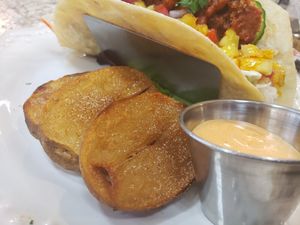 Seasoned Harvest Potatoes with Vegan Spicy Aioli at Harvest Kitchen & Bakery in Katy