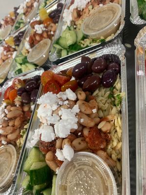 Greek Orzo bowl with marinated cucumbers, olives, violife feta, white bean salad and baby tomato medley.  at SoCo Vedge in Narragansett