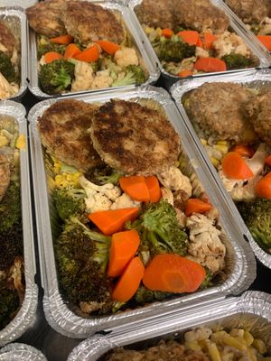 ‘Gansett “seafood” cakes with sweet corn succotash and roasted vegetables. at SoCo Vedge in Narragansett