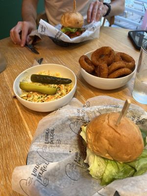 One house burger and one impressive burger, slaw and giant onion rings!   at Burger Fiancé in Montreal