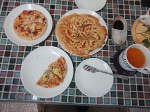 Savory and sweet pizzas, and cheese dumplings.   at Cocoya 可可亞手作廚房 in Kinmen