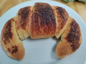Flaky cheese croissant at Bosque Urbano in San Jose