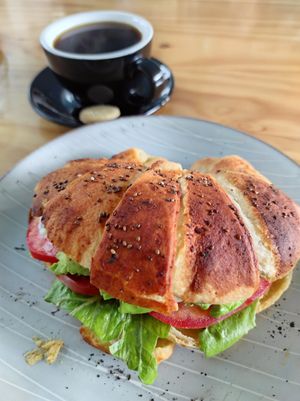Croissant Arreglado and Black Coffee. at Bosque Urbano in San Jose