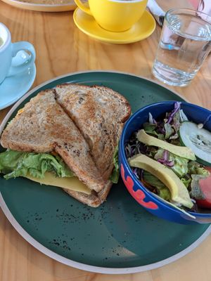 BLT cheese sandwich and side salad at Bosque Urbano in San Jose