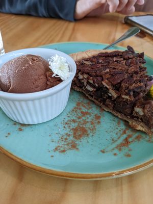 Pecan cake with chocolate ice cream at Bosque Urbano in San Jose