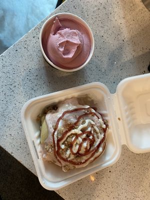 Raspberry dole whip soft serve (already munched on) and a raspberry cheesecake cinnamon bun.  at Cinnaholic in Wilmington