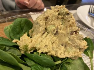 Half eaten Vegan chicken salad on spinach (served with Club crackers)   at The Coffee Factory in Muskegon
