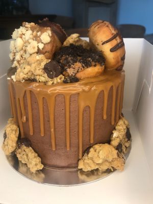 Our own Mini Donuts and Mini Cookie toppings on a vanilla sponge, chocolate icing and lotus drizzle cake at Lolu Bakes in Wexford