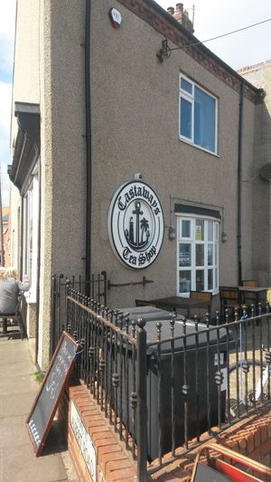 Exterior and outside seating at Castaways Tea Shop in Seaton Sluice