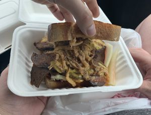 Brisket (Cole slaw and fried onion rings on the sandwich). It is massive!!! at The Joint Vegan Street Food in Colorado Springs