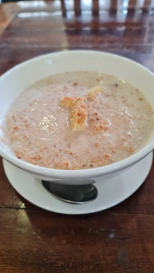 Oatmeal with banana, shredded coconut and almond milk. at Nang Sabai Cafe Artisan Bakery in Koh Samui