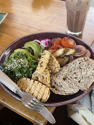 Custom brekkie with tempeh*2, tomatoes and onions, kale, avocado, mushrooms, sourdough bread   at Nang Sabai Cafe Artisan Bakery in Koh Samui