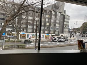View out the window. Lots of signs out front to point the way.  at Vegan Bistro Jangara in Tokyo