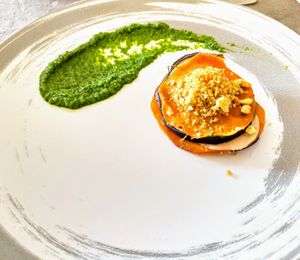 Eggplant millefoglie with vegan mozzarella, pumpkin and pistacchio crumble on top, with an arugula pesto at Lucato Home Restaurant in Montorso Vicentino