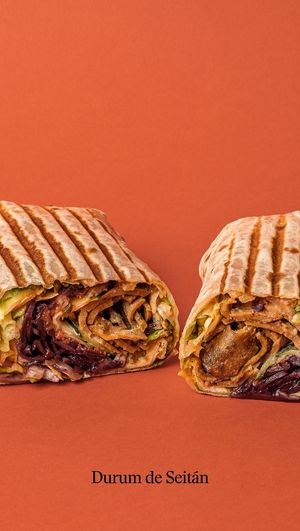 Marinated seitan in a wheat wrap with pickled cabbage, lettuce, cucumber, onion and piparra. With soy yogurt sauce and hot sauce. at Good Shit, Vegan Kebabs in Barcelona
