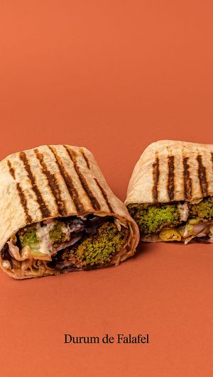 Homemade falafel in a wheat tortilla with pickled cabbage, lettuce, cucumber, onion and piparra. With soy yogurt sauce and hot sauce. at Good Shit, Vegan Kebabs in Barcelona